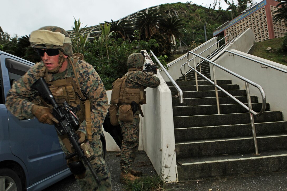 Marines with the security element of the Maritime Raid Force, 31st Marine Expeditionary Unit, egress from the stairway of a cleared building following the withdrawal of the assault force during a raid capture/kill exercise here, Jan. 5. Part of a semiannual training package, the Maritime Raid Force is evaluated and critiqued by Special Operations Training Group, III Marine Expeditionary Force. The 31st MEU is the only continuously forward-deployed MEU and is the Marine Corps’ force in readiness in the Asia-Pacific region.