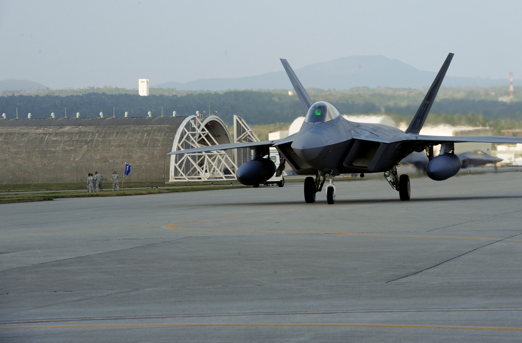 F-22A Raptors and about 300 Airmen from the 1st Fighter Wing, Joint Base Langley-Eustis, Va., and the 192nd Fighter Wing, Va. Air National Guard, deployed to Kadena Air Base, Japan, on Jan. 14, 2013. The F-22 deployment is in support of U.S. Pacific Command's security obligations in the Western Pacific. The deployed unit will perform training under the direction of the 18th Wing. (U.S. Air Force photo/Airman 1st Class Justin Veazie)