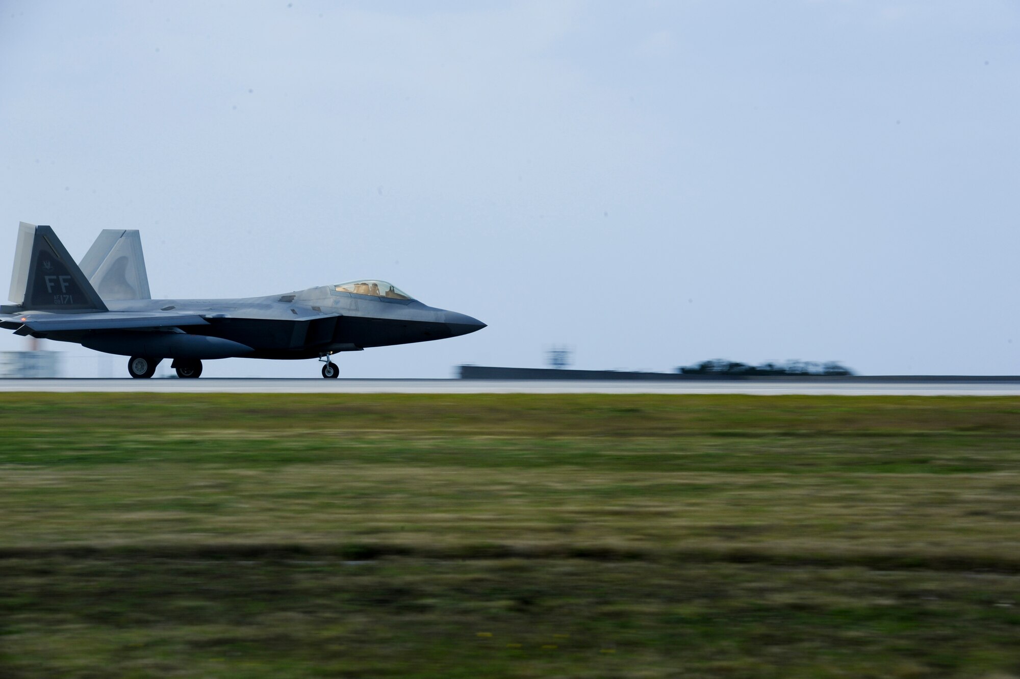 F-22A Raptors and about 300 Airmen from the 1st Fighter Wing, Joint Base Langley-Eustis, Va., and the 192nd Fighter Wing, Va. Air National Guard, deployed to Kadena Air Base, Japan, on Jan. 14, 2013. The F-22 deployment is in support of U.S. Pacific Command's security obligations in the Western Pacific. The deployed unit will perform training under the direction of the 18th Wing. (U.S. Air Force photo/Airman 1st Class Justin Veazie)