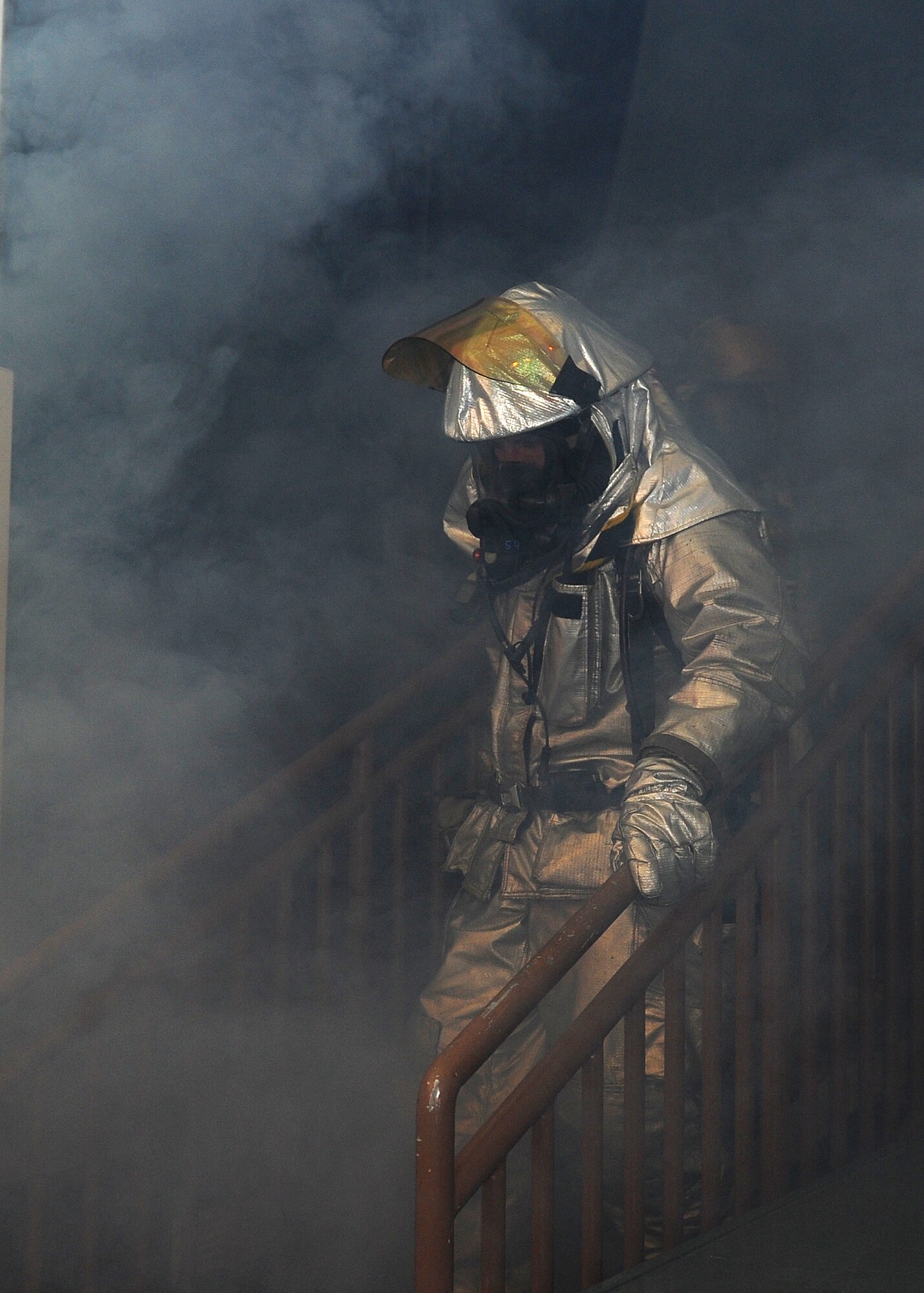 Senior Airman Kody Branson, 8th Civil Engineer Squadron firefighter, searches the base theater following a simulated mortar attack at Kunsan Air Base, Republic of Korea, Jan. 15, 2012. Firefighters responded to a fire at the theater and searched the building for possible casualties. (U.S. Air Force photo by Staff Sgt. Jonathan Fowler/Released)