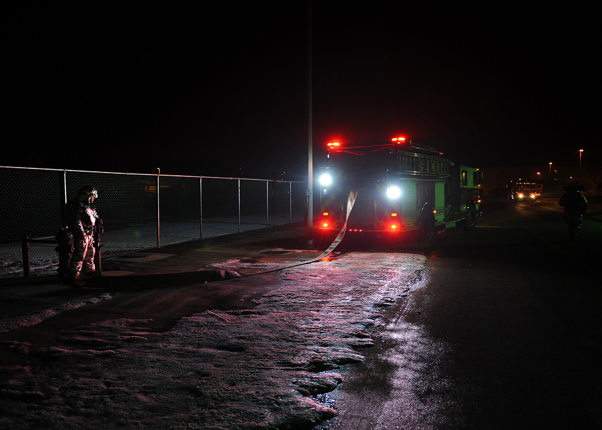 An 8th Civil Engineer Squadron (CES) fire engine is moved into position in order to respond to a simulated fire during exercise Beverly Midnight 13-1 at Kunsan Air Base, Republic of Korea, Jan. 15, 2013. Firefighters with the 8th CES were assessed on their ability and readiness to respond to a fire following a simulated attack and on how effectively they searched for possible wounded personnel. (U.S. Air Force photo by Staff Sgt. Jonathan Fowler/Released) 
