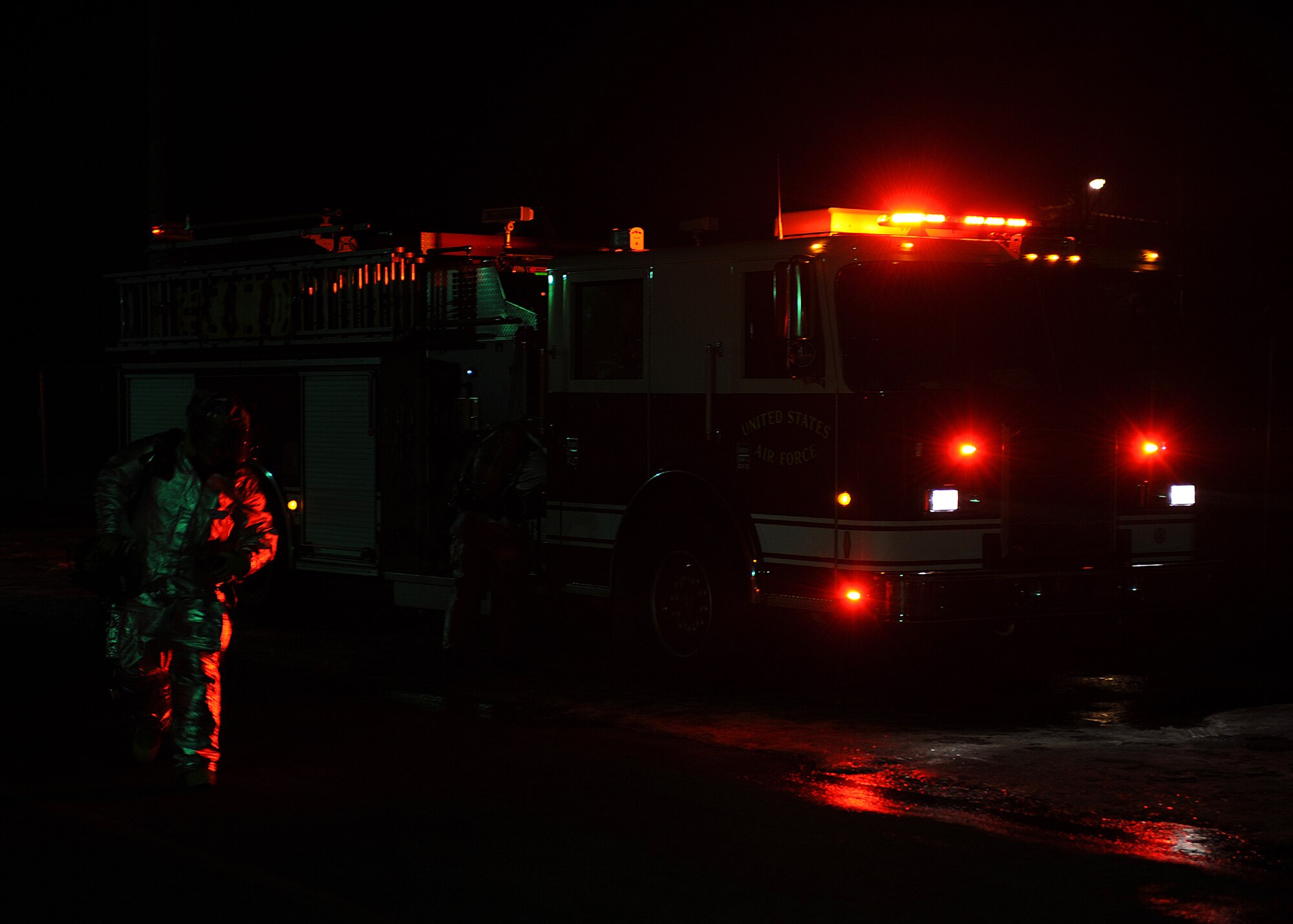 Firefighters from the 8th Civil Engineer Squadron respond to a simulated fire during exercise Beverly Midnight 13-1 at Kunsan Air Base, Republic of Korea, Jan. 15, 2012. The simulated fire tested the firefighters’ ability to fight a fire and search for wounded following a mortar attack. (U.S. Air Force photo by Staff Sgt. Jonathan Fowler/Released)