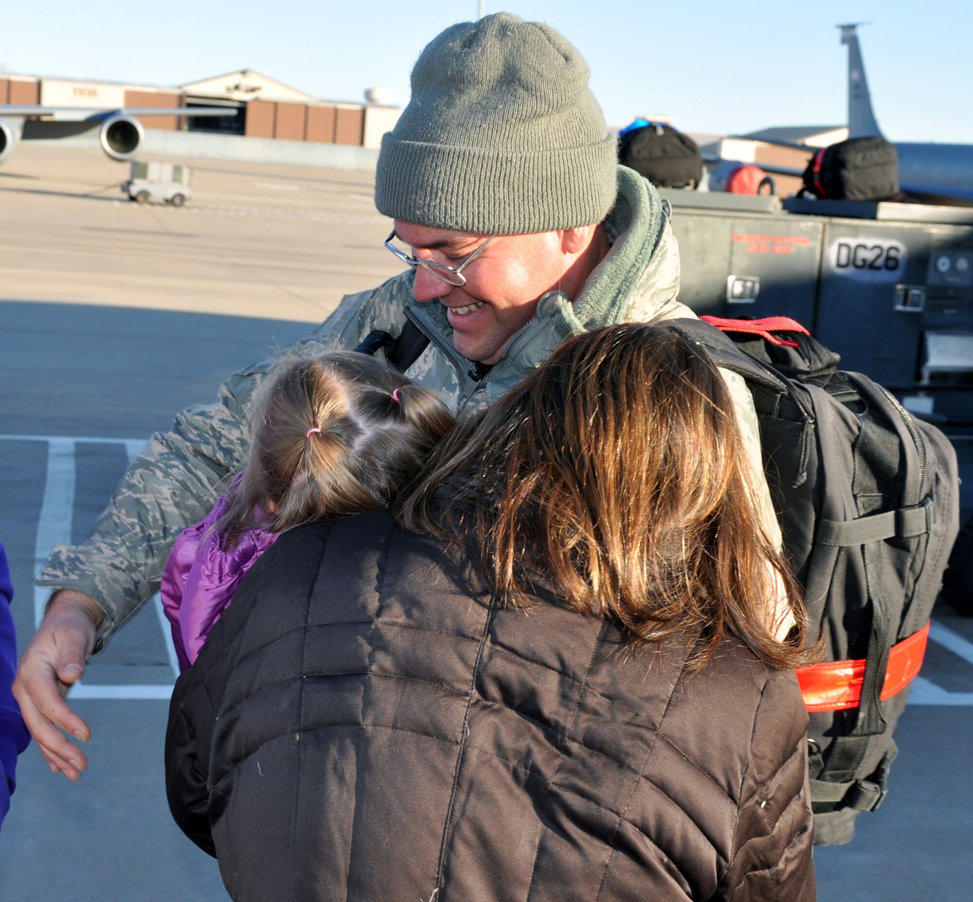 Tech. Sgt. Daniel Blondell is greeted by his family on the flightline at McConnell Air Force Base, Kan., Jan. 14, 2013.  Blondell had just returned from a deployment to Southwest Asia.  (U.S. Air Force photo by 1st Lt. Zach Anderson)