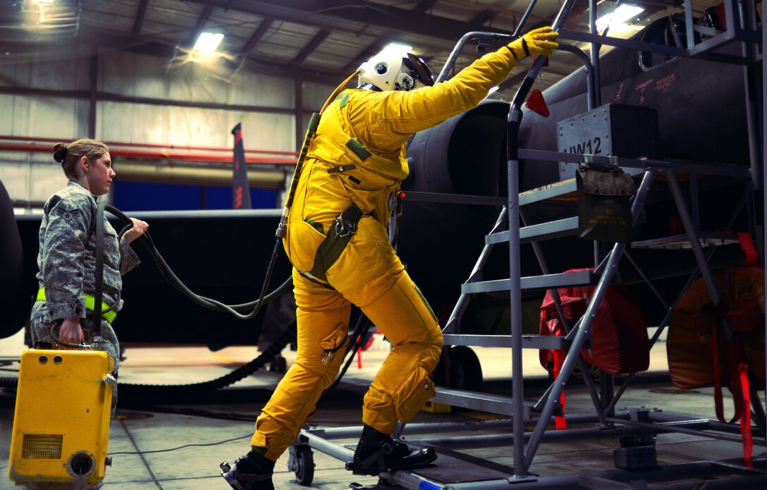 U-2 pilot Capt. Travis prepares to enter the cockpit of a U-2 Dragon Lady as Staff Sgt. Heather Doyle assists in the “hook up” of necessary life support systems Jan. 8, 2013, at Beale Air Force Base, Calif. Once situated in the pressurized cockpit, U-2 pilots have a strict limitation of movement due to the full pressure suit and size of the cockpit. (U.S. Air Force photo by Airman 1st Class Drew Buchanan/Released)