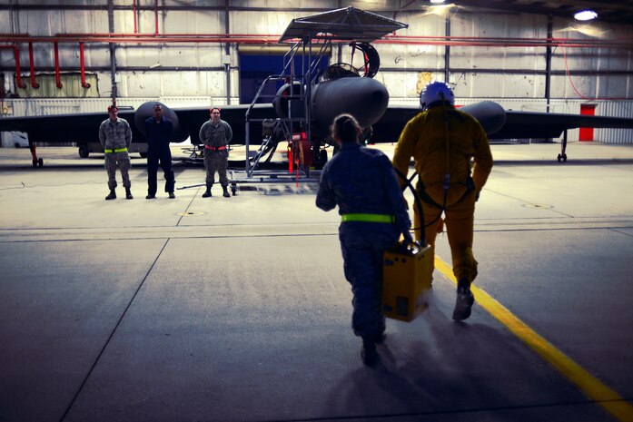 Maintenance personnel from the 9th Aircraft Maintenance Squadron standby as Capt. Travis and Staff Sgt. Heather Doyle prepare the cockpit of a U-2 Dragon Lady Jan. 8, 2013, at Beale Air Force Base, Calif. It takes dozens of personnel to prepare, launch and recover each of the 33 U-2s assigned to Beale Air Force Base. (U.S. Air Force photo by Airman 1st Class Drew Buchanan/Released)