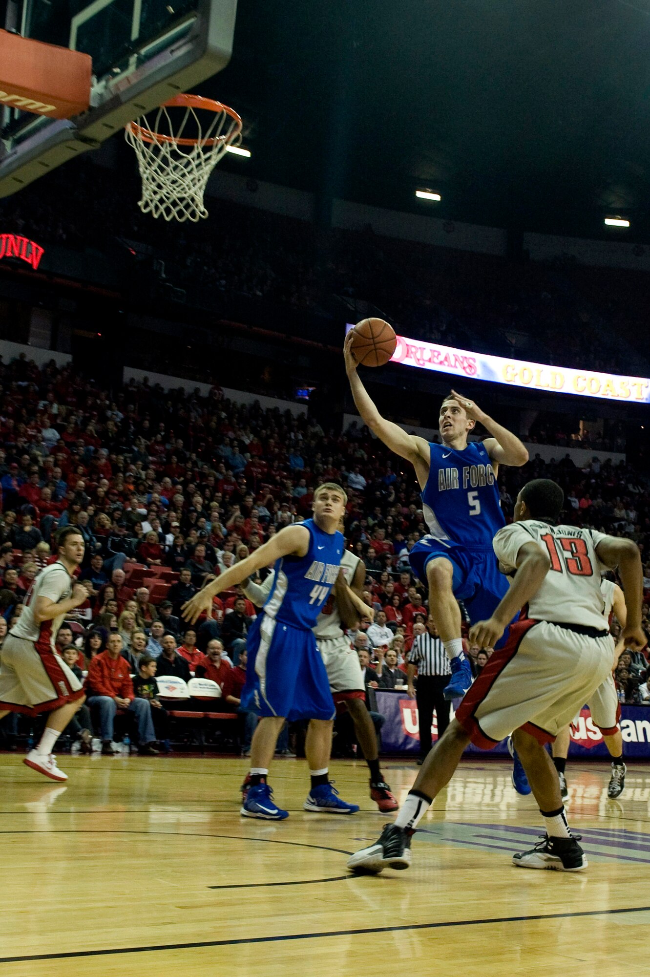 Mike Fitzgerald, U.S. Air Force Academy Falcons senior forward, takes the ball to the hoop for a lay-up in a game against the University of Nevada Las Vegas, Jan. 12, 2013, at the Thomas and Mack Center in Las Vegas. Fitzgerald lead the Falcons with 22 points in an overtime loss against UNLV. (U.S. Air Force photo by Senior Airman Daniel Hughes)
