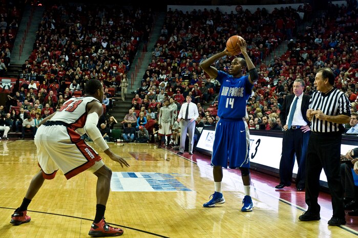 Michael Lyons, U.S. Air Force Academy Falcons senior guard, looks for an open teammate during a game  against the University of Nevada Las Vegas, Jan. 12, 2013, at the Thomas and Mack Center in Las Vegas. UNLV defeated the Falcons in overtime with a final score of 76-71. (U.S. Air Force photo by Senior Airman Daniel Hughes)