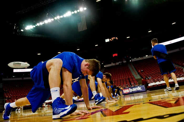 Members of the U.S. Air Force Academy Falcons basketball team stretch before a game against the University of Nevada Las Vegas, Jan. 12, 2013, at the Thomas and Mack Center in Las Vegas. Pregame warm-ups allow the players to stretch and prepare mentally for the game. (U.S. Air Force photo by Senior Airman Daniel Hughes)