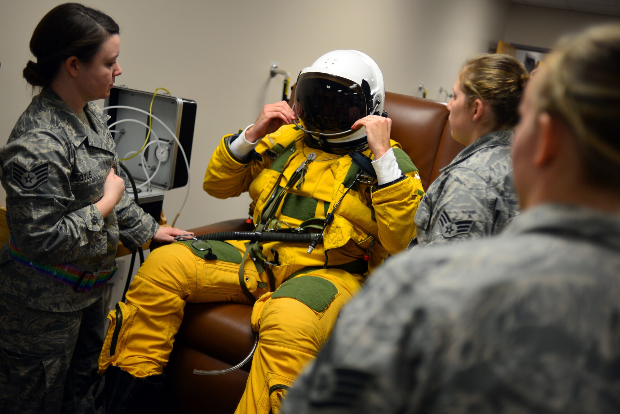 U-2 pilot Capt. Travis dawns the sun visor on his pressure suit helmet during pre-flight suit dawning in preparation for a “high flight” in the U-2 Dragon Lady Jan. 8, 2013, at Beale Air Force Base, Calif. The full pressure suit, developed by the U.S. Air Force has been adopted by NASA and other agencies for use by astronauts and other high altitude crews. (U.S. Air Force photo by Airman 1st Class Drew Buchanan/Released)