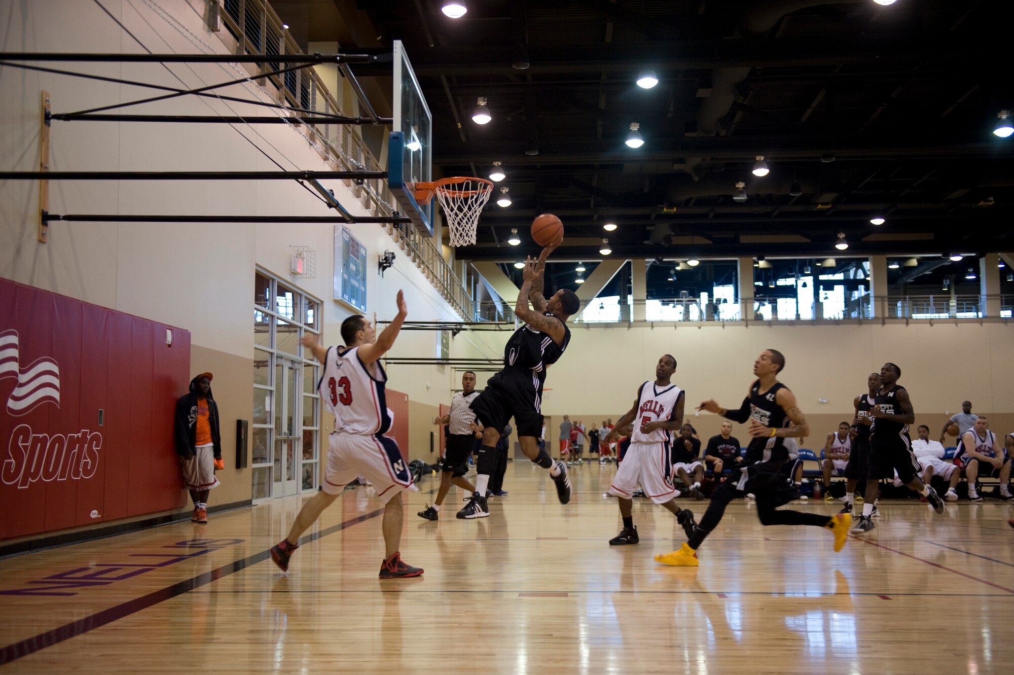 A Soldier from Fort Bliss, Texas, jumps for a lay-up during a game against Nellis, Jan. 12, 2013, at Nellis Air Force Base, Nev. Fort Bliss emerged victorious over the other teams after the Pacific West Military Basketball League this weekend. (U.S. Air Force photo by Senior Airman Daniel Hughes)