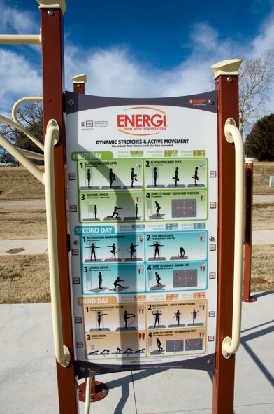 Users of the Sheppard Par Course can get fully interactive during family fitness.  Directions for each exercise station are posted and fitness buffs can use their smartphone applications to integrate with the course.  (U.S. Air Force photo/Frank Carter)