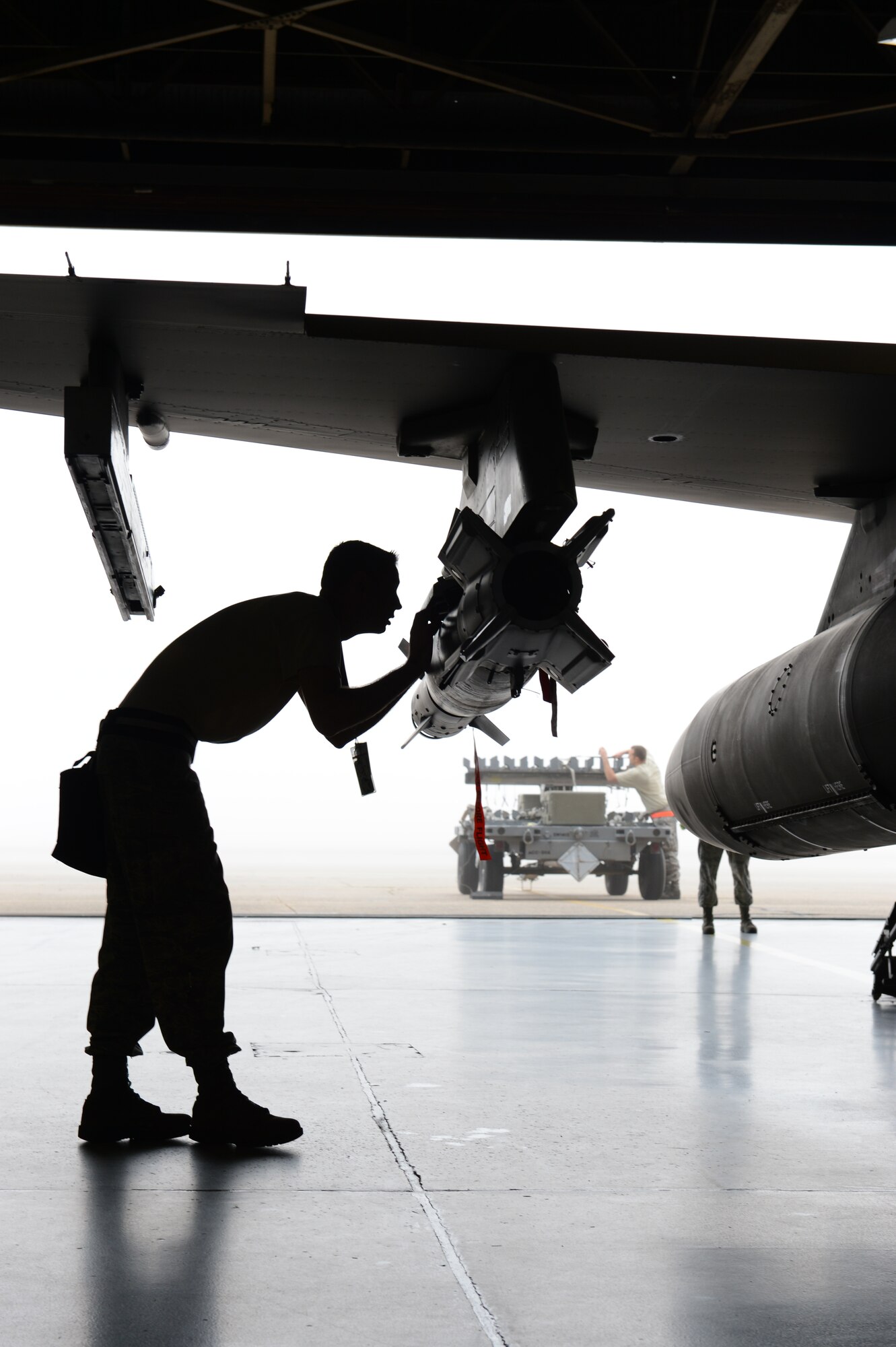 U.S. Air Force Staff Sgt. Joshua Humphreys, 20th Aircraft Maintenance Squadron weapons load crew member, ensures the Guided Bomb Unit 12 is properly loaded onto the F-16 Fighting Falcon at Shaw Air Force Base, S.C., Jan. 11, 2013. During the fourth Weapons Load Crew of the Quarter competition, two crews competed to become eligible for the Load Crew of the Year. The winners were the 79th "Tigers." (U.S. Air Force photo by Senior Airman Tabatha Zarrella/Released)
