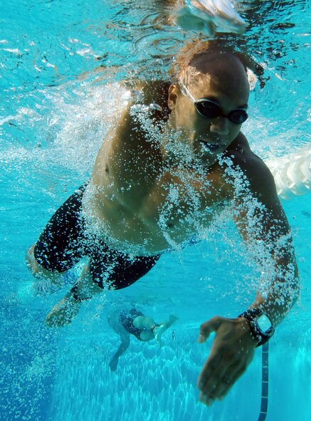 Siddig Mirgham swims during the first portion of the fall triathlon Sept. 22 at Silver Wings Pool. Mirgham completed the swim in 6:41 and completed the triathlon in 1:12:35 earning him fourth place. (U.S. Air Force photo/Airman 1st Class David Owsianka)