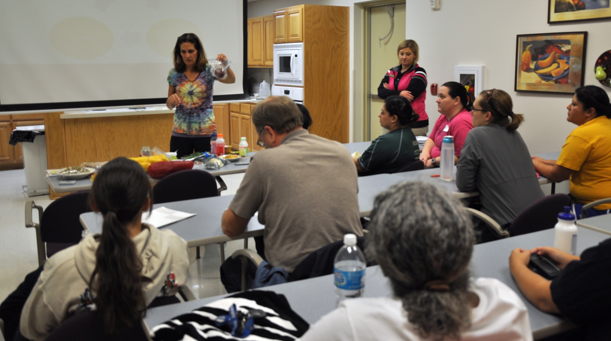 GOODFELLOW AIR FORCE BASE, Texas – Kathy Viau, 17th Medical Group health promotion dietitian, explains nutritional facts for the Better Body. Better Life. program at the Health and Fitness Center here, Jan. 10. During this portion of the program, Viau talked about how many calories are in various foods. (U.S. Air Force photo/ Airman 1st Class Joshua Edwards)