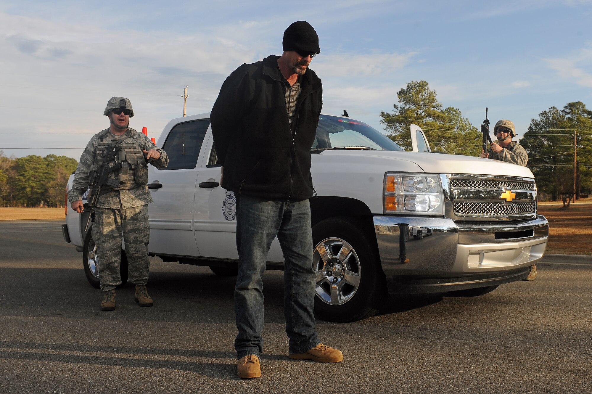 U.S. Air Force Airmen assigned to the 4th Security Forces Squadron move in to subdue a simulated gate runner during Phase I of Operational Readiness Exercise Coronet Warrior 13-01 on Seymour Johnson Air Force Base, N.C., Jan. 14, 2013. OREs test Airmen’s ability to survive and operate in wartime environments. (U.S. Air Force photo/Airman 1st Class John Nieves Camacho/Released)