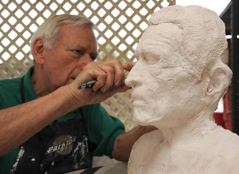 Robert Sutz files one of his life masks at his studio April 6 in Scottsdale. Sutz has been recognized in America and abroad for his sensitive portrayals of urban scenes, and he has won praise for his portraits and life masks of prominent individuals. Most recently, Sutz has focused full-time on making life masks of Holocaust survivors and creating paintings based on the stories they have described to him during interviews. His work was on display during the Days of Remembrance at Luke Air Force Base. (U.S. Air Force photo/Staff Sgt. Darlene Seltmann)
