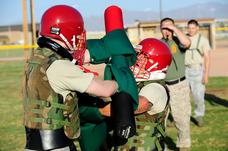 Senior Airman Taylor Sterrett and Staff Sgt. John Chambers, 56th Communications Squadron, spar during the Marine Corps Martial Arts Program April 11. Participants in MCMAP learn close combat fighting techniques, weapons basic movements, character, and mental and physical disciplines. (U.S. Air Force photo/Staff Sgt. Jason Colbert)