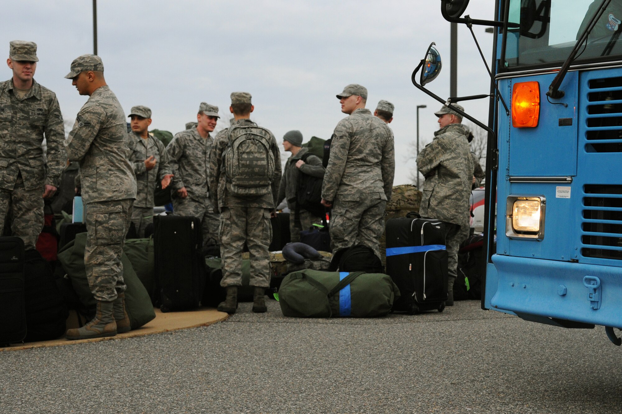 U.S. Air Force Airmen of the 94th Air Maintenance Unit prepare to depart on a deployment at Langley Air Force Base, Va., Jan. 8, 2013. Roughly 300 Airmen from the 1st Fighter Wing and the 192nd fighter wing are schedule to deploy to Kadena Air Base, Japan in support of Pacific Air Forces Theater Security Package. (U.S. Air Force photo by Airman 1st Class Victoria Taylor/Released)