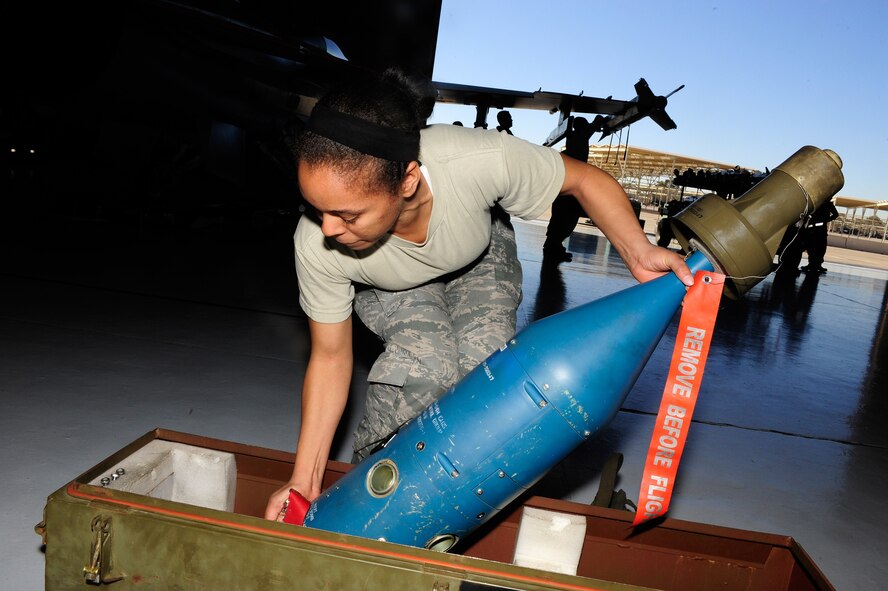 Airman 1st Class Brittney Jones, 56th Aircraft Maintenance Squadron, checks a bomb that will be loaded onto an aircraft Jan. 13 during the fourth quarter load crew competition. The load crew competition pits weapons load crews against each other to see who can load the fastest with the fewest deficiencies. (U.S. Air Force photo/Staff Sgt. Jason Colbert)