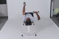Dumbbell bench press
Grab a pair of dumbbells, lie on back on a flat bench and hold the dumbbells above chest. Palms should be facing inward. Lower one dumbbell to the side of chest, while simultaneously rotating wrists so palm faces forward. Pause, then press weight back up to starting position quickly, while rotating wrists so palms are once again facing inward. Repeat with other arm. ( U.S. Air Force photo by Don Lindsey )

