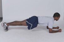 Hover plank
Get into a pushup position, but bend elbows to rest weight on forearms instead of hands. The body should form a straight line from shoulders to ankles. Brace core by contracting abs. Hold position for the desired time. ( U.S. Air Force photo by Don Lindsey
