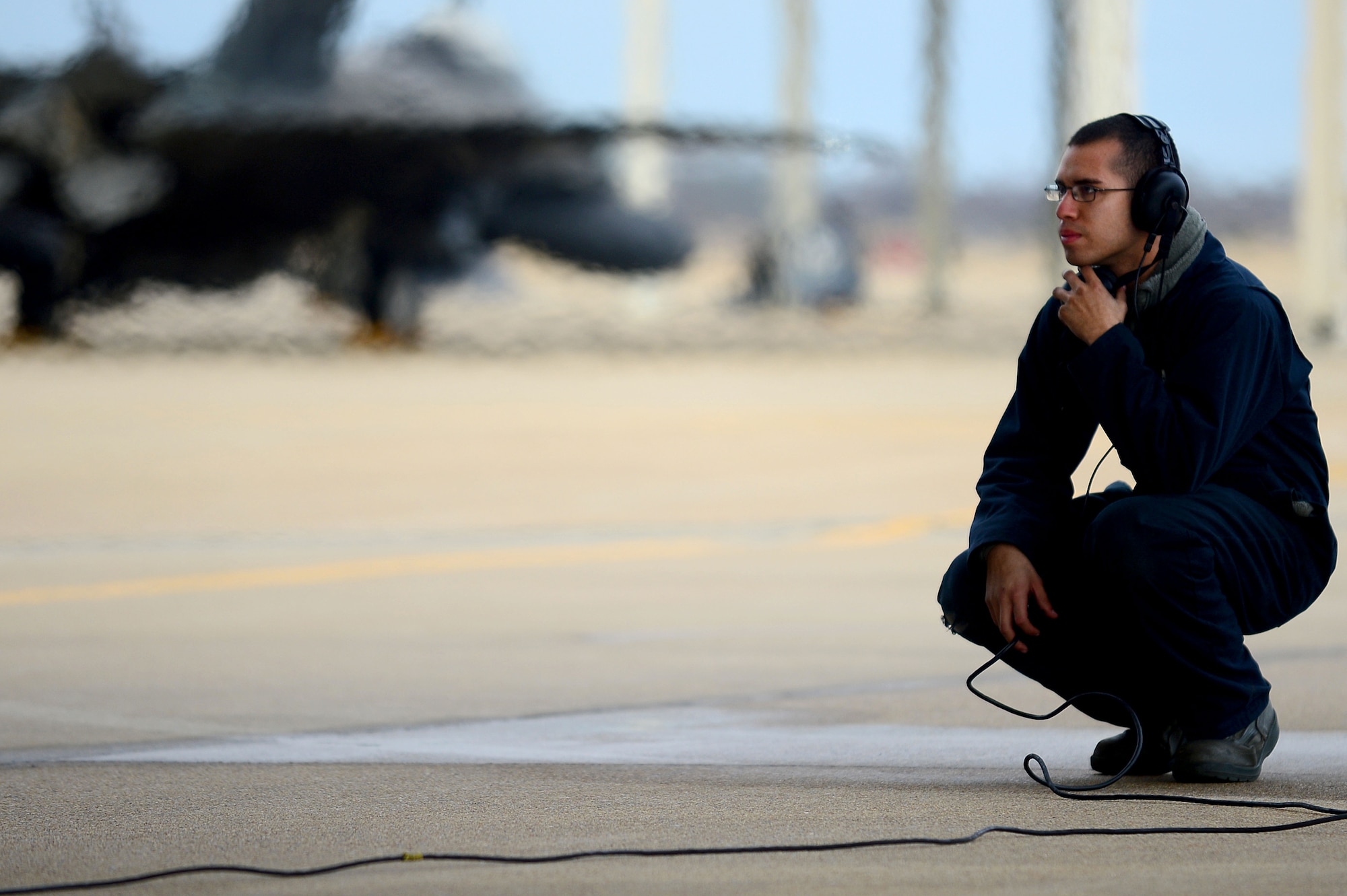 U.S. Air Force Staff Sgt. Alvin Salguero, 94th Air Maintenance Unit F-22 crew chief, performs a preflight check on an F-22 Raptor prior to departure at Langley Air Force Base, Va., Jan. 11, 2013. The F-22 deployment to Kadena Air Base, Japan, is in support of security obligations of the U.S. Pacific Command’s in the Western Pacific, under the direction of the 18th Wing at Kadena AB.  (U.S. Air Force photo by Senior Airman Kayla Newman/Released)