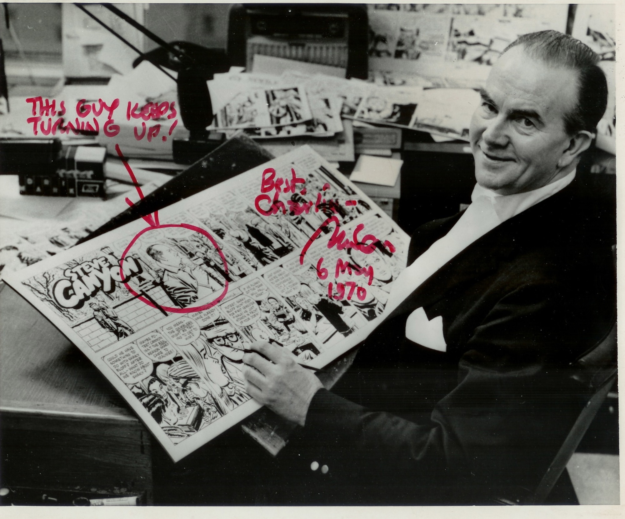 American cartoonist Milton Caniff poses with his “Steve Canyon” comic strip featuring “Charlie Vanilla,” a character inspired by his friend Retired Lieutenant Colonel Charles Russhon, one of the original Air Commandos and military advisor to the James Bond films in the ‘60s and ‘70s. The signed photograph features a circled “Charlie Vanilla,” aka Russhon, and says “this guy keeps turning up!” (Photo courtesy of Christian Russhon)