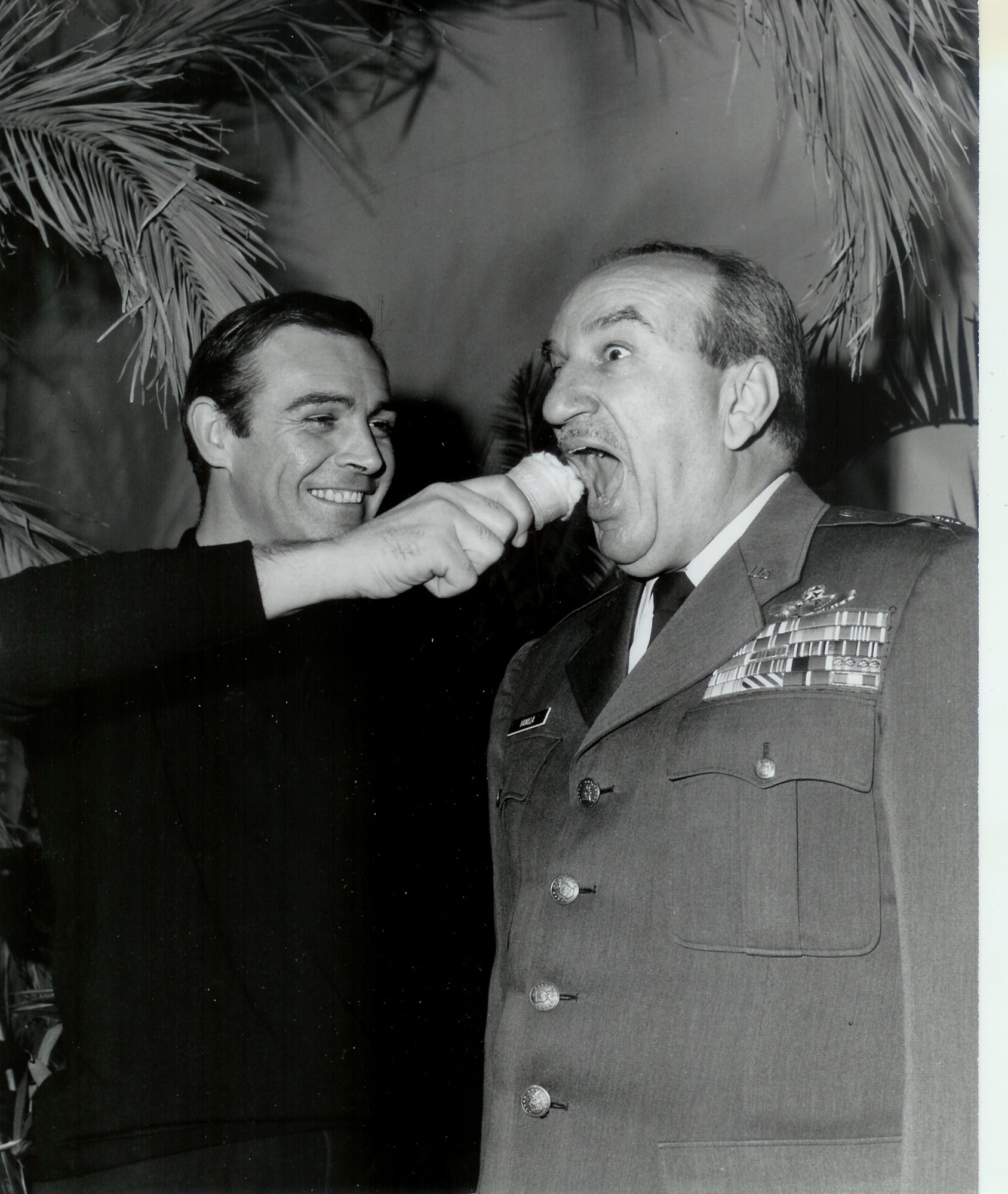 Sean Connery feigns shoving a vanilla ice cream cone in Retired Lieutenant Colonel Charles Russhon’s face during the production of “Thunderball.” Russhon was the military advisor to the James Bond films in the ‘60s and ‘70s. Russhon and Connery became friends on set. The vanilla ice cream cone had special significance to Russhon, who inspired the “Charlie Vanilla” character, an ice cream loving mister fix-it, in friend and esteemed American cartoonist Milton Caniff’s comic strip “Steve Canyon.” (Photo courtesy of Christian Russhon)