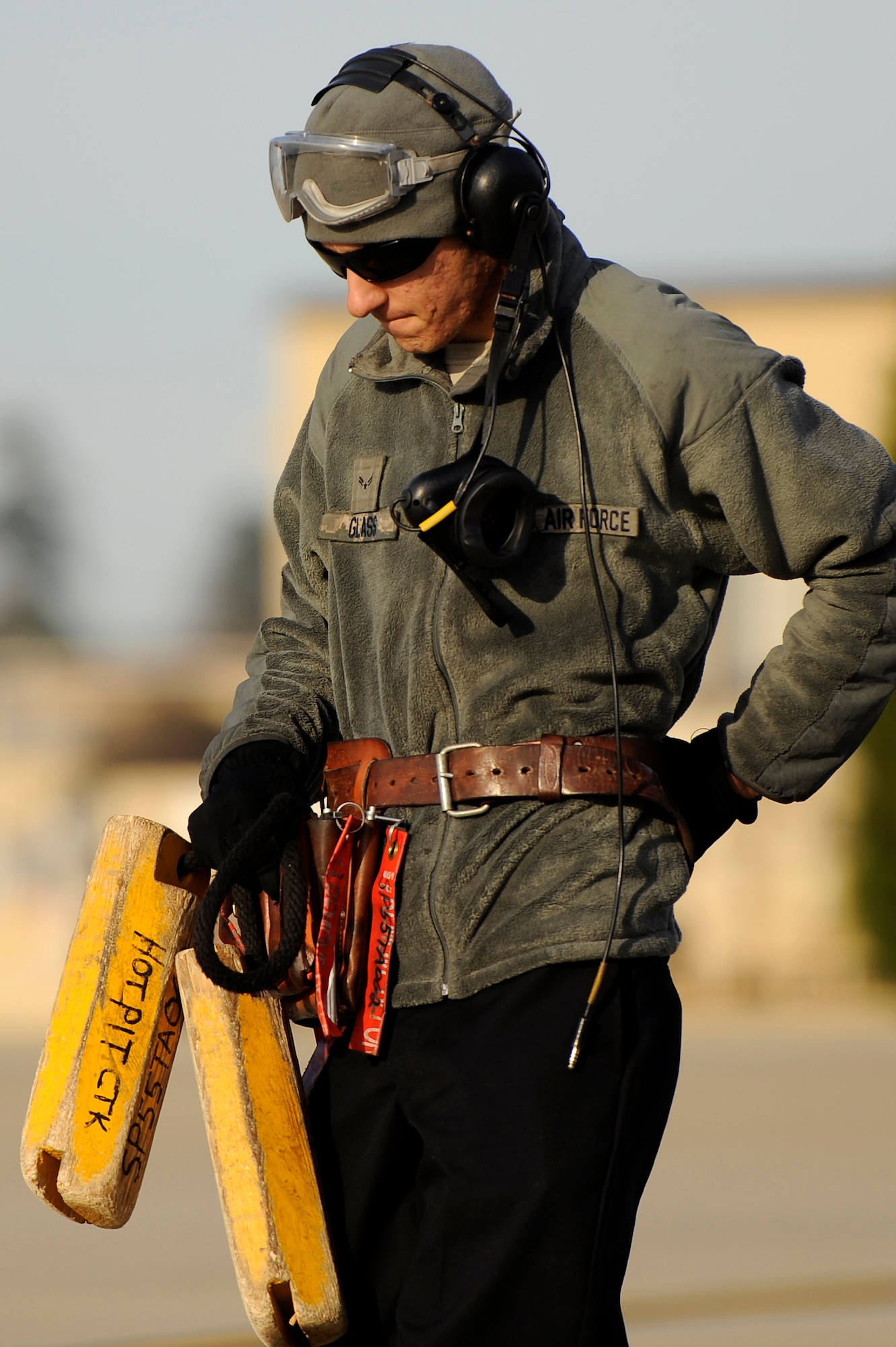U.S. Air Force Airman 1st Class Justin Glass, 20th Aircraft Maintenance Squadron aircraft maintainer, carries the “hot pit” chalks to the designated hot pit area to begin refueling F-16 Fighting Falcons, Jan. 10, 2013, Shaw Air Force Base, S.C. Fuels operators and crew chiefs such as Brightwell performed hot pit refueling procedures for both the 55th and 79th Fighter Squadrons. Hot pit refueling is a procedure usually performed in a combat situation to rapidly refuel aircraft while their engines are running resulting in a speedy refuel to thrust pilots back into the fight. (U.S. Air Force photo by Staff Sgt. Kenny Holston)(Released)