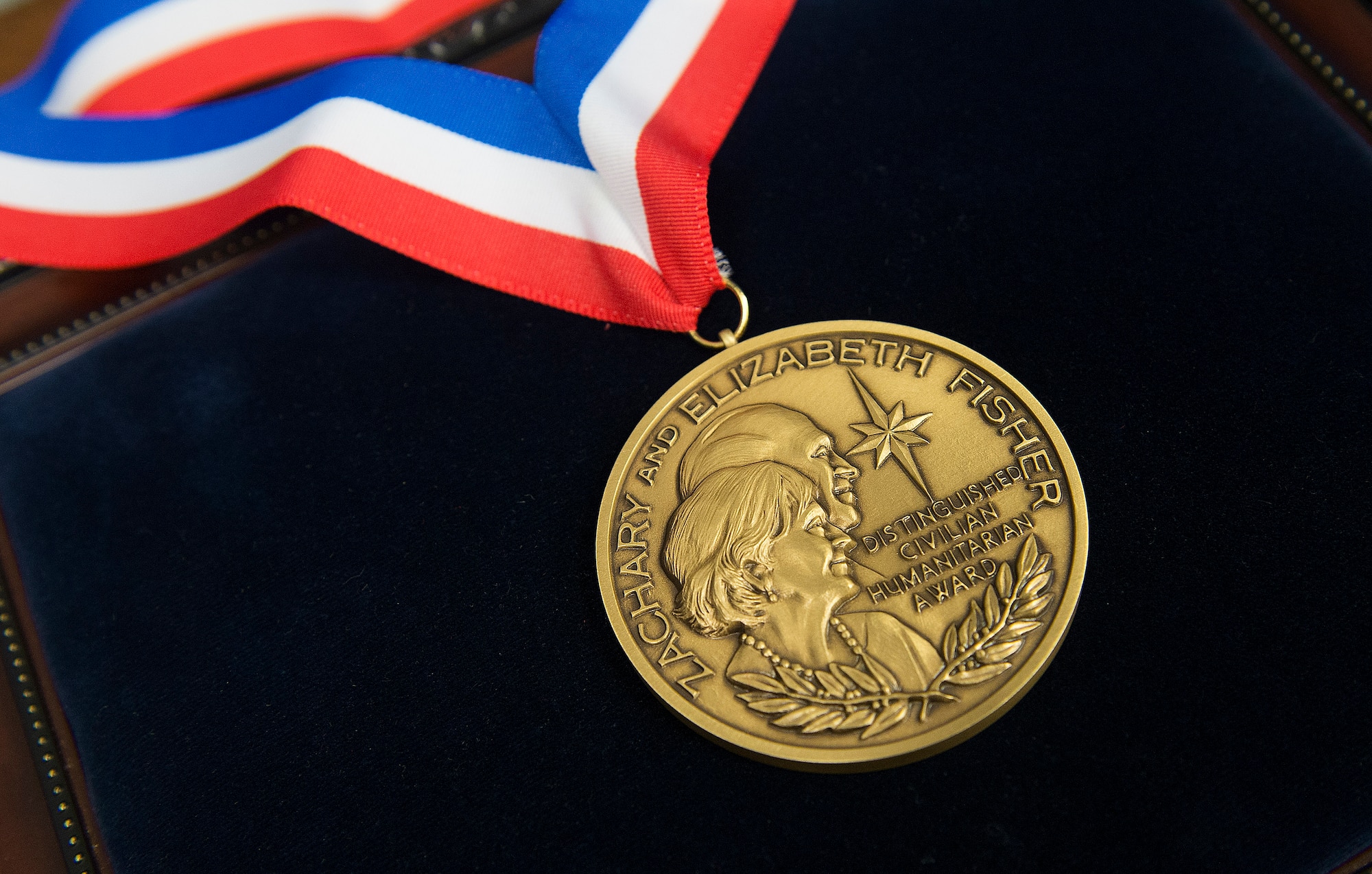 Secretary of the Air Force Michael Donley presented the 2011 Zachary and Elizabeth Fisher Distinguished Civilian Humanitarian Service Award to Chris Sehman during a ceremony held in the Pentagon, Washington, D.C., Jan. 10, 2013. The award recipient must exemplify Zachary and Elizabeth Fisher's personal qualities of patriotism, generosity, and selfless dedication to improving the quality of life of members of the U.S. Armed Forces. Sehman distinguished himself as a local community and business leader in the Florida Emerald Coast area. He served as an Honorary Commander for the 36th Electronic Warfare Squadron at Eglin Air Force Base, and the 1st Special Operations Wing at Hurlburt Field, Fla., and was a staunch advocate for the Special Operations Warrior Foundation and Wounded Warrior Program. (U.S. Air Force photo/Jim Varhegyi)