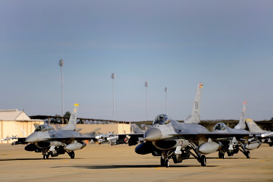 Several U.S. Air Force F-16 Fighting Falcon pilots sit on the ramp in the cockpit of their aircraft while waiting for fuel, Jan. 10, 2013, Shaw Air Force Base, S.C. Fuels operators and crew chiefs performed hot pit refueling procedures for both the 55th and 79th Fighter Squadrons. Hot pit refueling is a procedure usually performed in a combat situation to rapidly refuel aircraft while their engines are running resulting in a speedy refuel to thrust pilots back into the fight. (U.S. Air Force photo by Staff Sgt. Kenny Holston)(Released)
