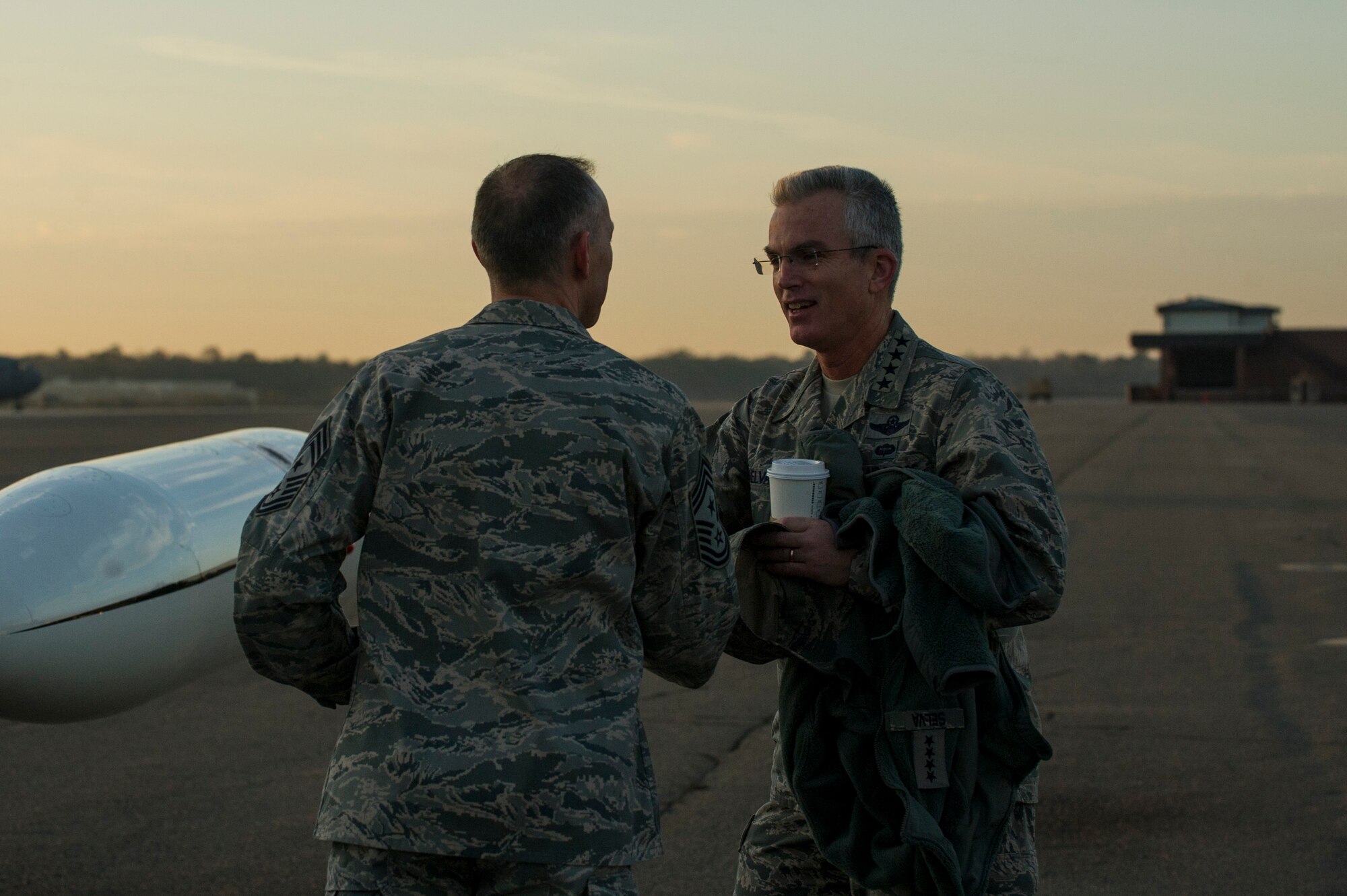 Gen. Paul Selva, Air Mobility Command commander, speaks to Chief Master Sgt. Larry Williams, 437th Airlift Wing command chief, before departing Joint Base Charleston – Air Base, S.C., Jan. 8, 2013. 
While in Charleston, Selva hosted an All Call for JB Charleston Airmen.
During the All Call, the general presented his three priorities for Mobility
Airmen: Executing the mission; Cultivating a caring and respectful
workplace; and Training Airmen.  (U.S. Air Force photo/Senior Airman George
Goslin)
