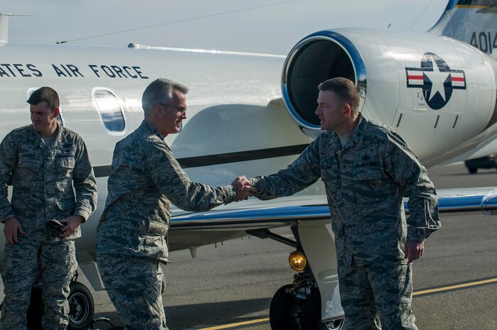 Col. Richard McComb, Joint Base Charleston commander, greets Gen. Paul Selva, Air Mobility Command commander Jan. 7, 2013, at Joint Base Charleston – Air Base, S.C.  While in Charleston, Selva hosted an All Call for JB Charleston Airmen.
During the All Call, the general presented his three priorities for Mobility
Airmen: Executing the mission; Cultivating a caring and respectful
workplace; and Training Airmen.  (U.S. Air Force photo/Senior Airman George
Goslin)
