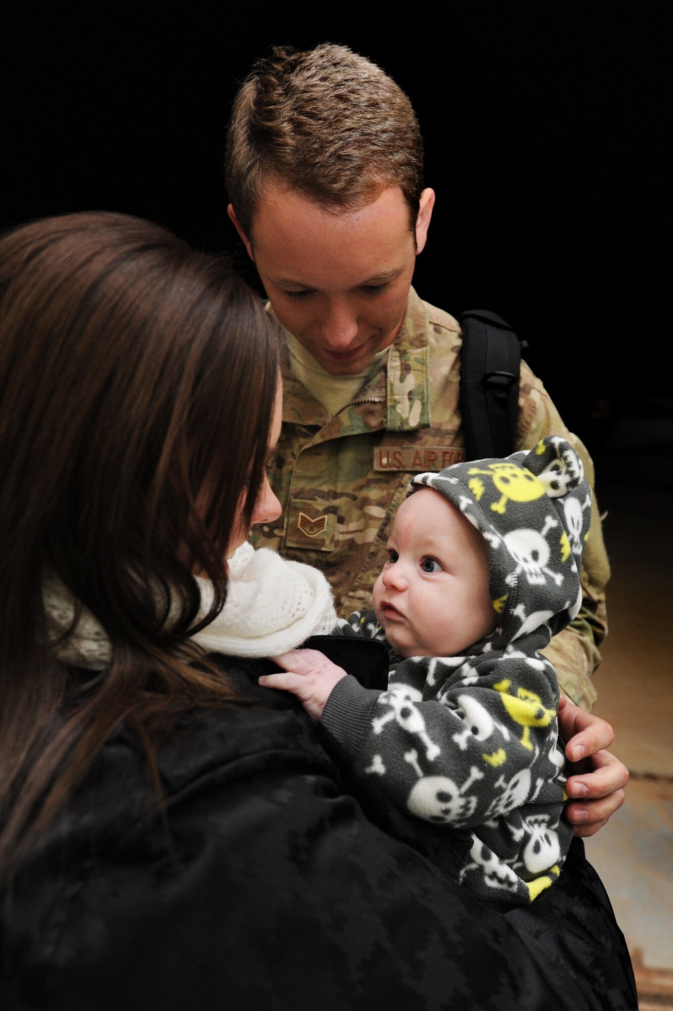 Families come together during Operation Homecoming at Cannon Air Force Base, N.M., Jan. 7, 2013.  Operation Homecoming is a monthly event that reunites Cannon's Air Commandos with their loved ones.  (U.S. Air Force photo/Senior Airman Jette Carr)