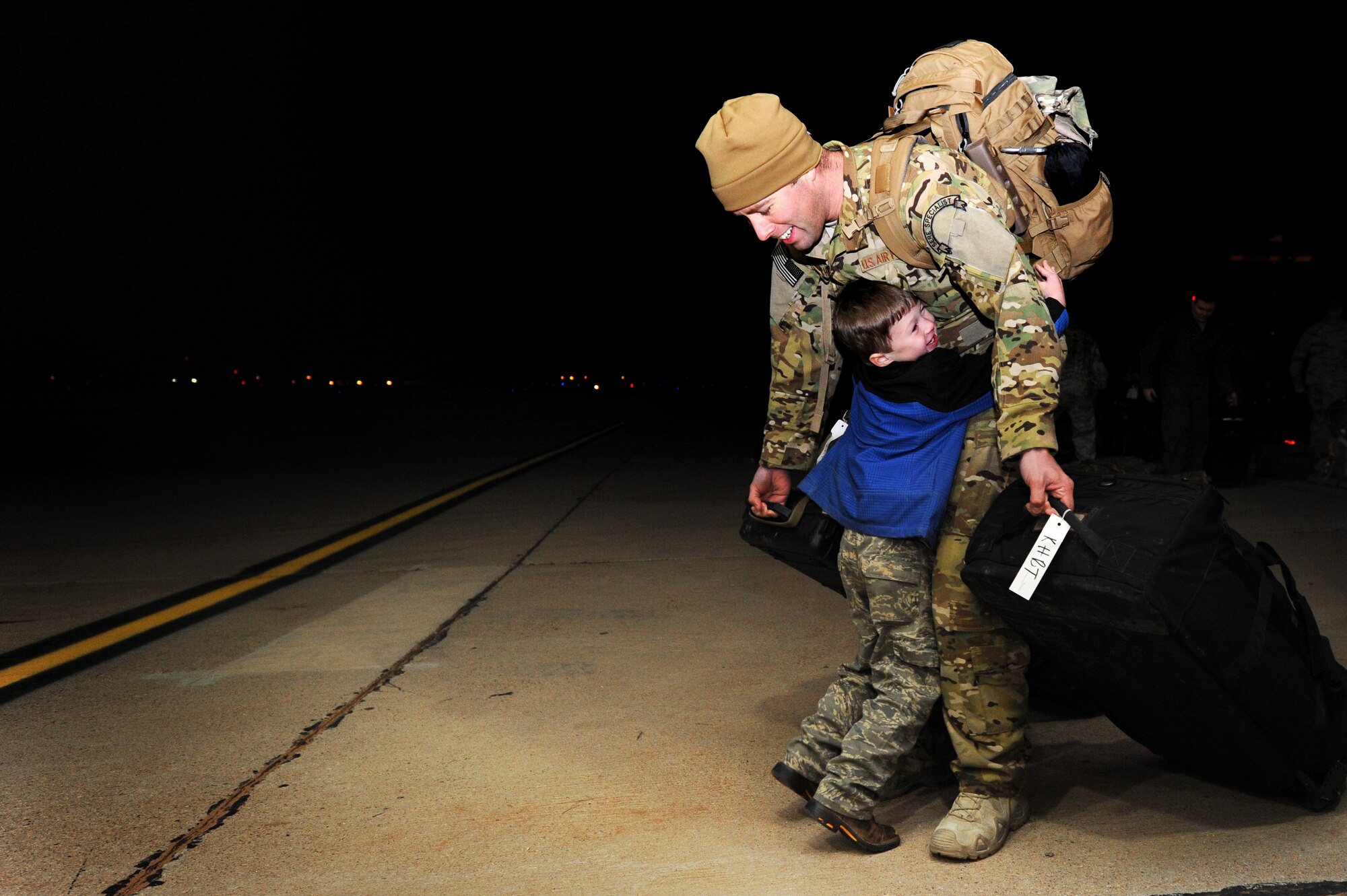 Families come together during Operation Homecoming at Cannon Air Force Base, N.M., Jan. 7, 2013.  Operation Homecoming is a monthly event that reunites Cannon's Air Commandos with their loved ones.  (U.S. Air Force photo/Senior Airman Jette Carr)