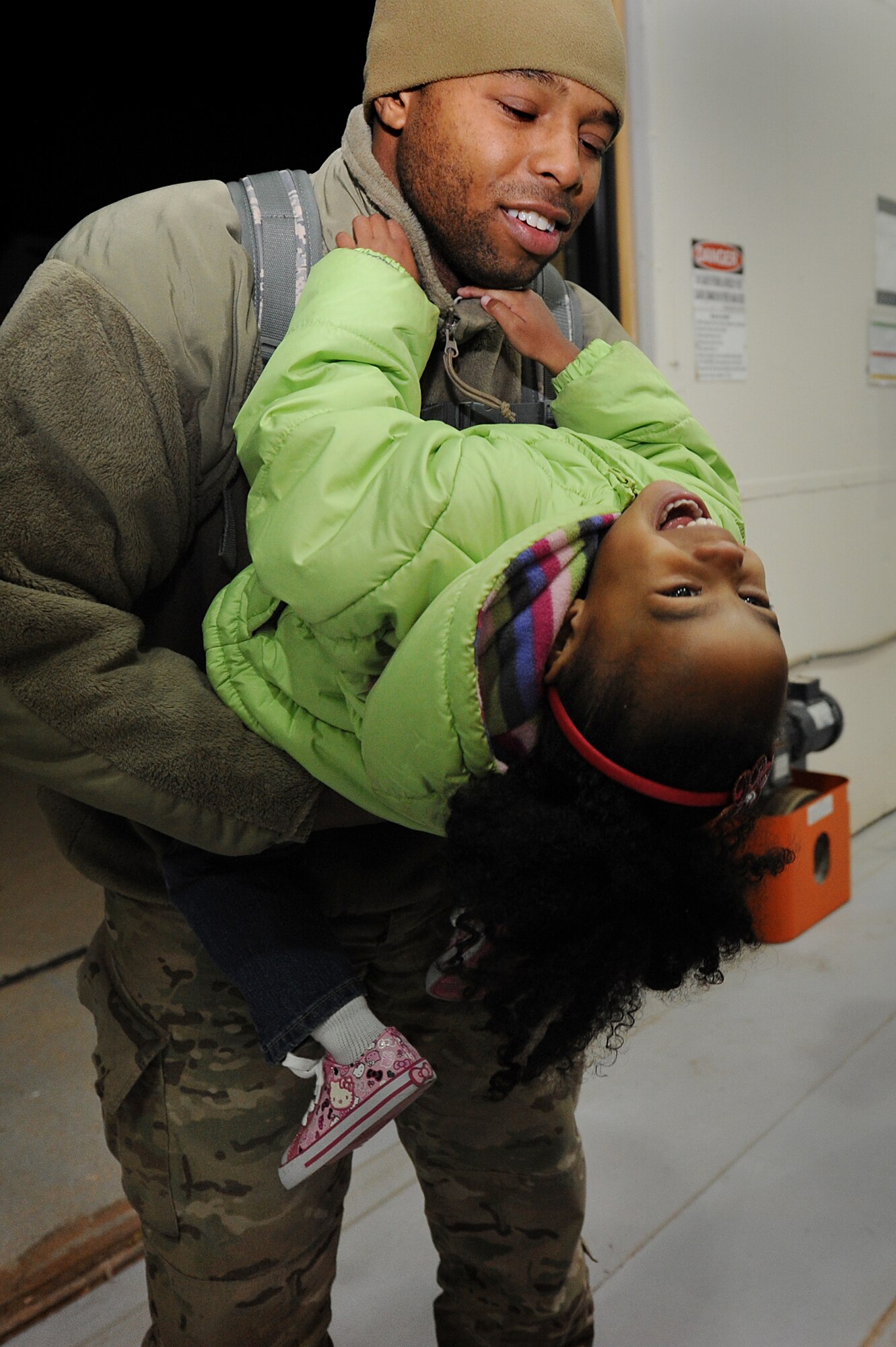 Families come together during Operation Homecoming at Cannon Air Force Base, N.M., Jan. 7, 2013.  Operation Homecoming is a monthly event that reunites Cannon's Air Commandos with their loved ones.  (U.S. Air Force photo/Senior Airman Jette Carr)