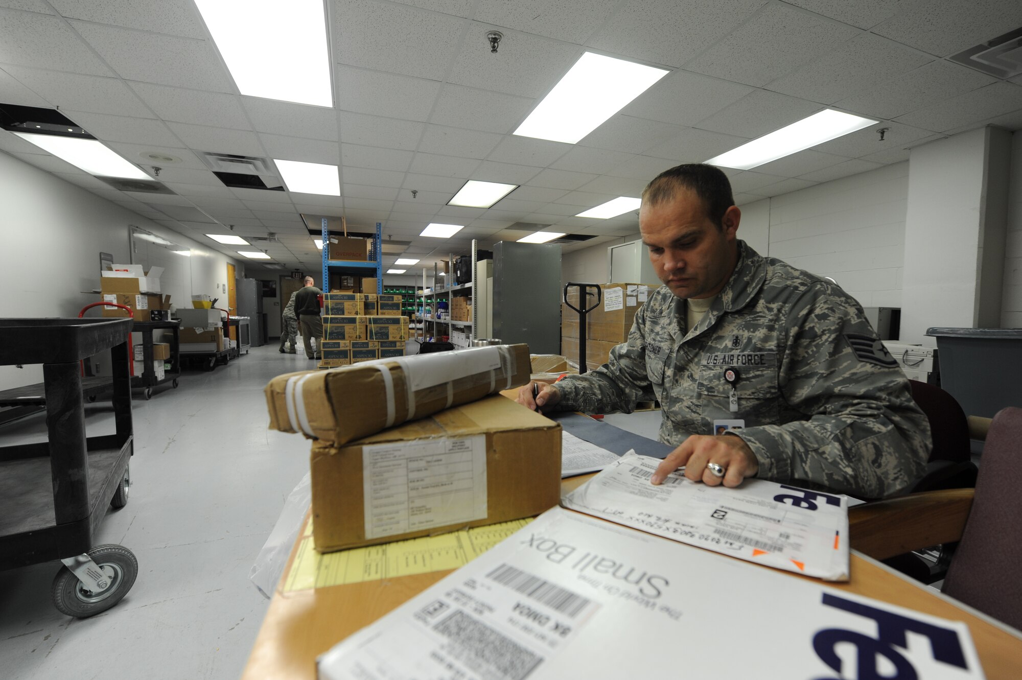 WHITEMAN AIR FORCE BASE, Mo. -- Staff Sgt. Jeremy Hightower, 509th Medical Support Squadron NCO in charge of acquisition management, documents items for internal tracking purposes in the medical logistics storeroom, Jan. 7. Members of the medical logistics flight are responsible for tracking every package that arrives to the building. (U.S. Air Force photo/Staff Sgt. Nick Wilson) (Released)