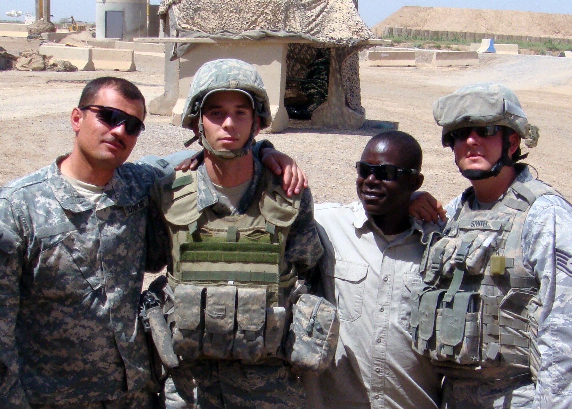 Staff Sgt. Daniel Ball, 366th Security Forces Squadron controller, and other Defenders pose for a photo at a deployed location in Iraq. With rockets exploding around him and an entry control point in complete chaos, Ball, a graduate of Yuba City High School, Calif., took decisive action to help quell the enemy threat and treat wounded comrades. (Courtesy photo)