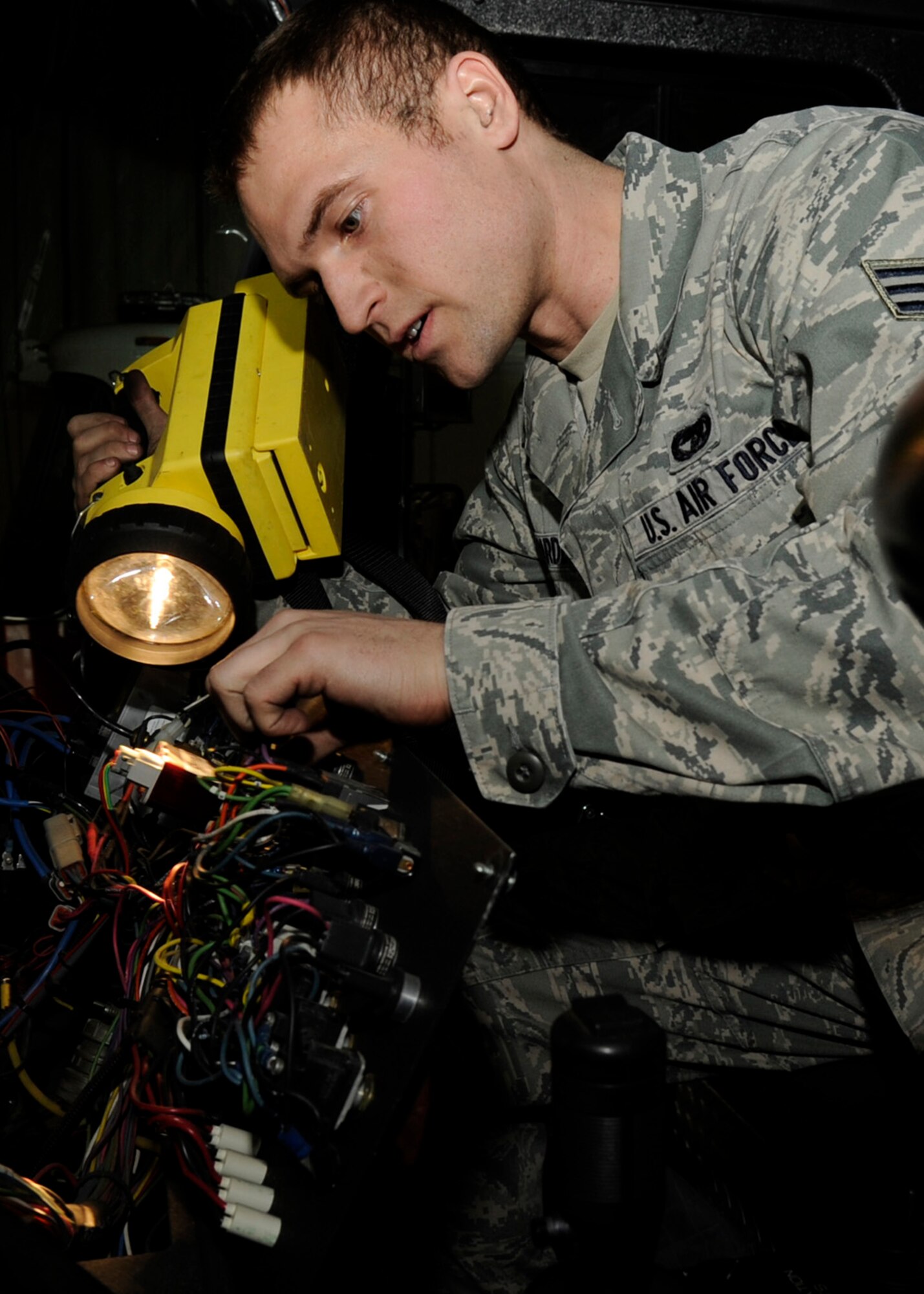 Senior Airman Spencer Hardesty, 8th Logistics Readiness Squadron fire truck and refueling maintenance journeyman, works Jan. 11, 2013, at Kunsan Air Base, Republic of Korea. Hardesty was named as the weekly “Pride of the Pack” winner for outstanding job performance. (U.S. Air Force photo by Staff Sgt. Tong Duong/Released) 