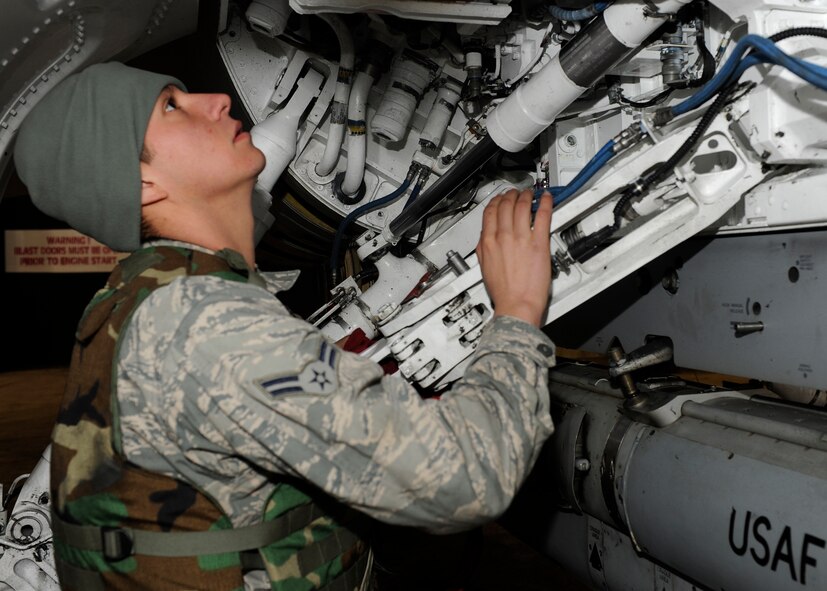 Airman 1st Class Jose Corral-Deleon, 8th Aircraft Maintenance inspects the F-16 Fighting Falcon before its departure during Beverly Midnight 13-1 at Kunsan Air Base, Republic of Korea, Jan. 14, 2013. The Airmen went around double checking the jet to guarantee it was error free before handing it over to the pilots. (U.S. Air Force photo by Senior Airman Marcus Morris/Released)