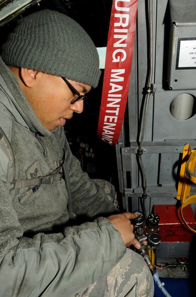 Staff Sgt. Dominique West, 20th Aircraft Maintenance Unit crew chief, inspects an emergency oxygen tank on Barksdale Air Force Base, La., Jan. 11. In the event of an onboard oxygen system malfunction, the emergency oxygen tanks are used by the aircrew. Crew chiefs inspect the tanks to ensure they are serviceable. (U.S. Air Force photo/Airman 1st Class Benjamin Gonsier)