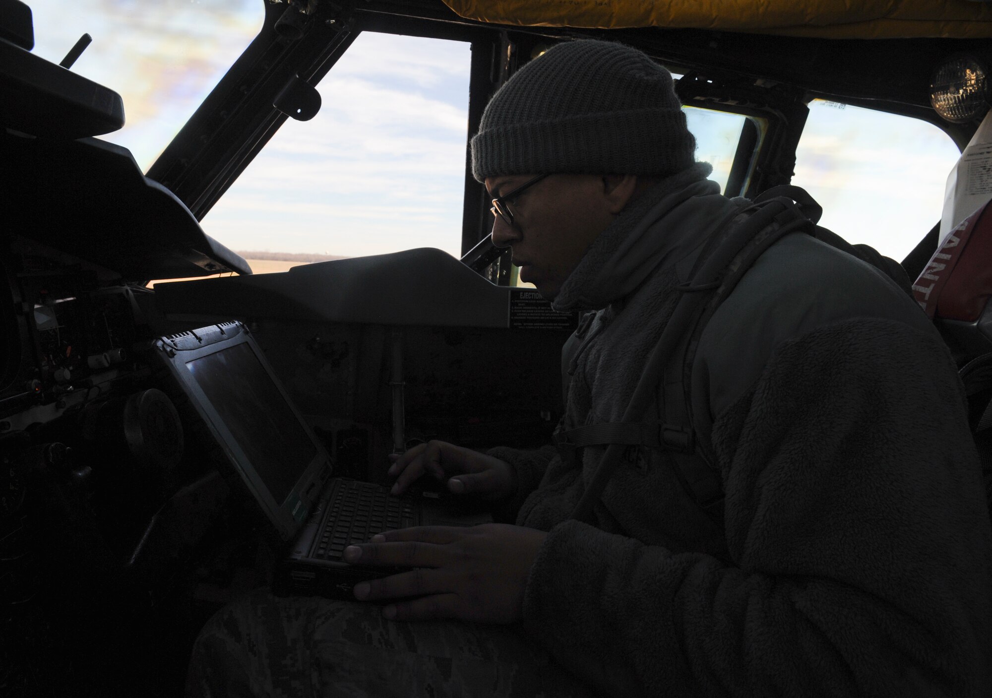 Staff Sgt. Dominique West, 20th Aircraft Maintenance Unit crew chief, reads a technical order inside a B-52H Stratofortress on Barksdale Air Force Base, La., Jan. 11. Inside the aircraft, crew chiefs inspect the light bulbs, and replace them if needed, the circuit breakers for some of the systems, fire extinguishers and the aircrew's onboard equipment. (U.S. Air Force photo/Airman 1st Class Benjamin Gonsier) 
