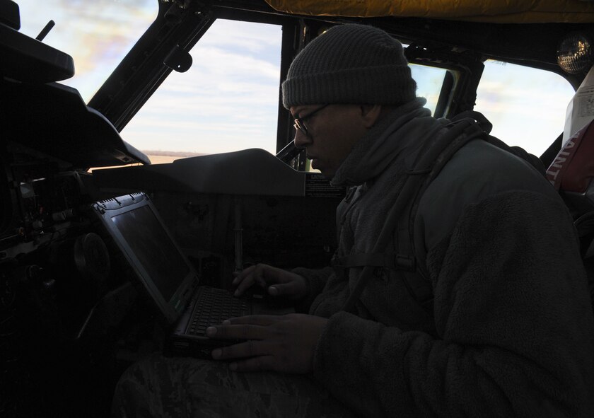 Staff Sgt. Dominique West, 20th Aircraft Maintenance Unit crew chief, reads a technical order inside a B-52H Stratofortress on Barksdale Air Force Base, La., Jan. 11. Inside the aircraft, crew chiefs inspect the light bulbs, and replace them if needed, the circuit breakers for some of the systems, fire extinguishers and the aircrew's onboard equipment. (U.S. Air Force photo/Airman 1st Class Benjamin Gonsier) 

