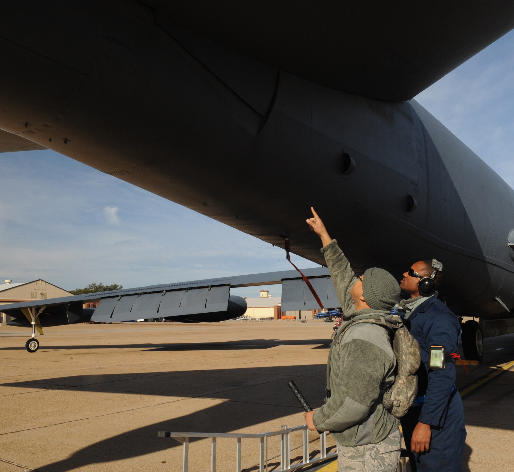 Staff Sgt. Dominique West and Senior Airman Princeton Drake, 20th Aircraft Maintenance Unit crew chiefs, discuss how to fix the stabilizer of a B-52H Stratofortress after inspecting it on Barksdale Air Force Base, La., Jan. 11. Maintainers can perform more than 30 jobs during a routine pre-flight inspection of an aircraft. (U.S. Air Force photo/Airman 1st Class Benjamin Gonsier)