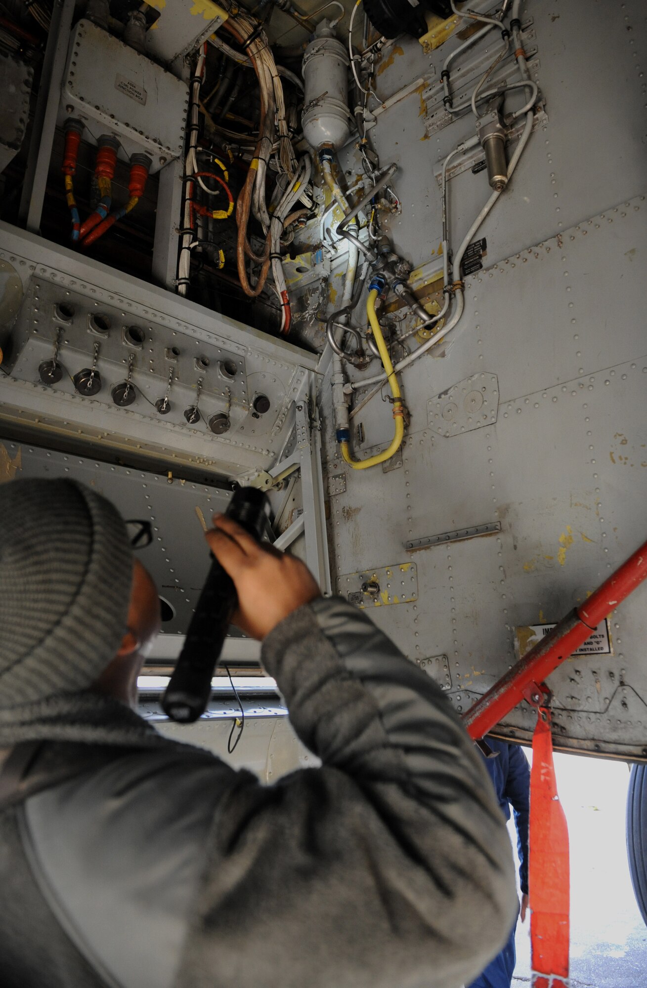 Staff Sgt. Dominique West, 20th Aircraft Maintenance Unit crew chief, checks the wiring inside a B-52H Stratofortress on Barksdale Air Force Base, La., Jan. 11. During pre-flight inspections, crew chiefs check the interior and exterior of the aircraft for any abnormalities. (U.S. Air Force photo/Airman 1st Class Benjamin Gonsier)