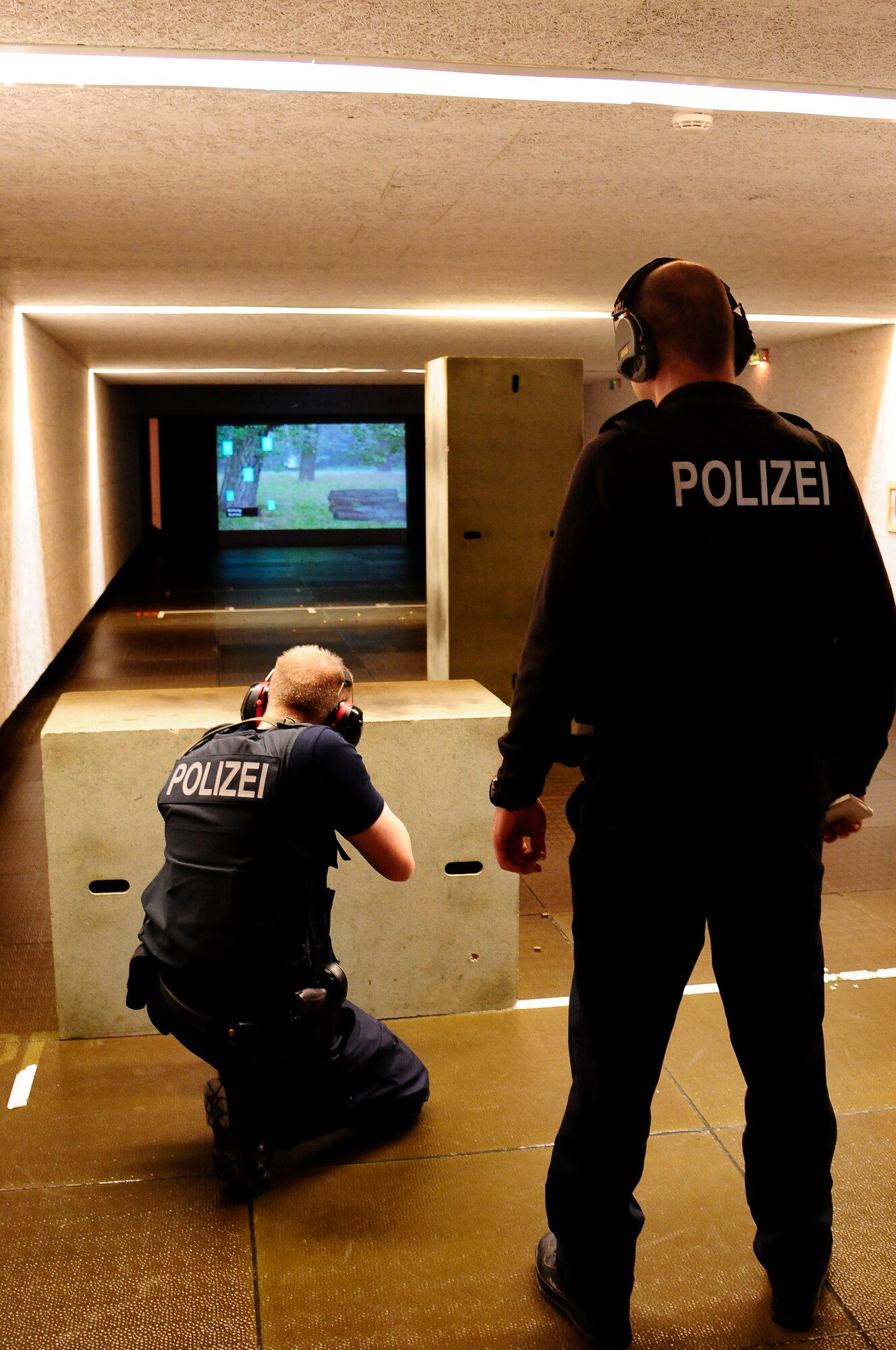 Members of the Deutsche Bundespolizei, German Federal Police, practice shooting an H&K MP5 sub machine gun during a training session between members of the 86th Security Forces Squadron and the Deutsche Bundespolizei, German Federal Police, in Bexbach, Germany, Jan. 11, 2013. The training session was a unique opportunity given to members of the 86th SFS to become more familiar with the German weapons systems and tactics. (U.S. Air Force photo/Airman 1st Class Hailey Haux)