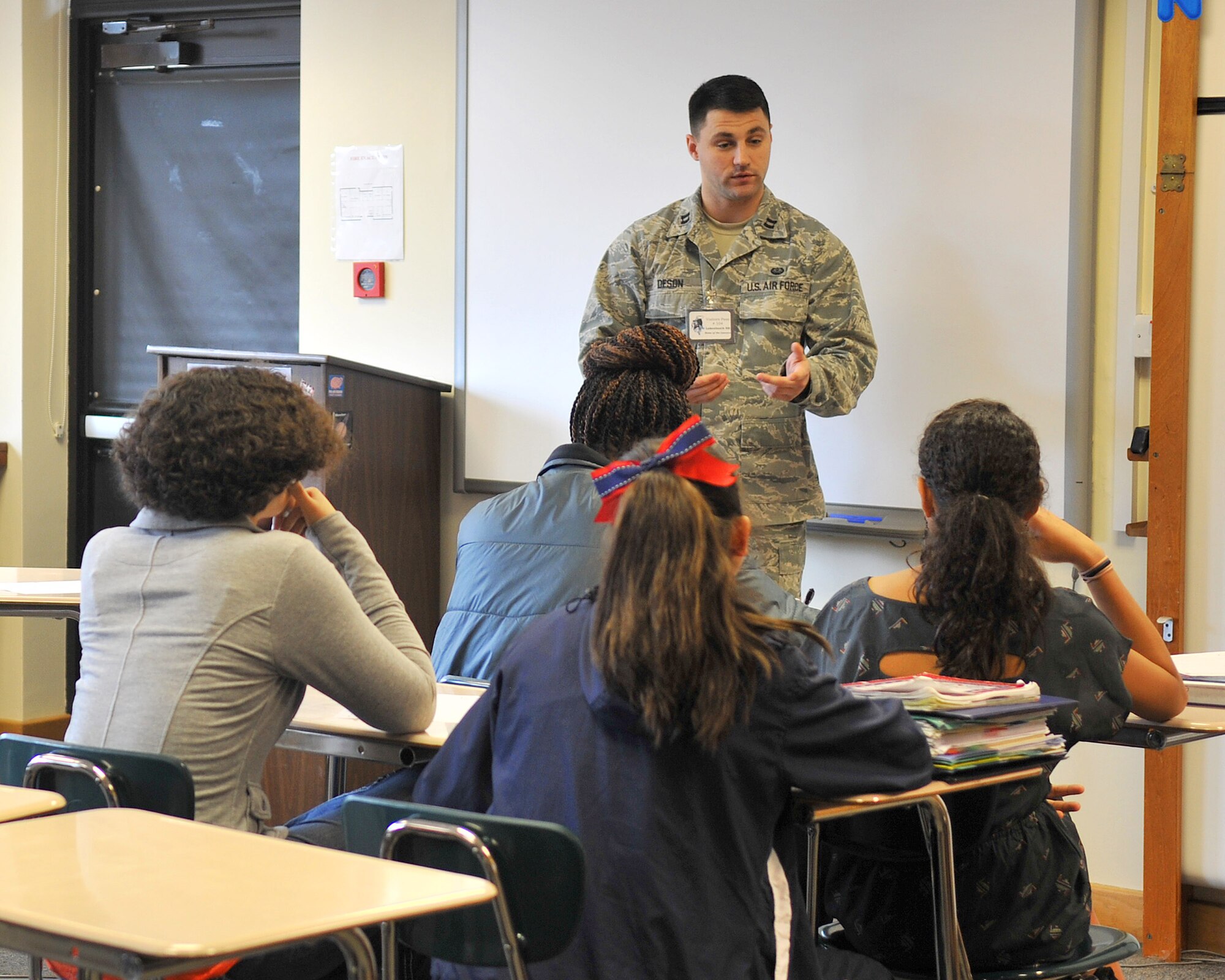 Capt. Jason DeSon, 352nd Special Operations Group chief of international law, RAF Mildenhall, speaks to students Jan. 11, 2013, at Lakenheath High School, RAF Lakenheath, England. DeSon, a native of Los Angeles, and other Airmen from RAF Mildenhall and RAF Lakenheath took part in the school’s “15 minutes of Fame” program, aimed to provide students an opportunity to speak to individuals with experience in professions that interest the students most. (U.S. Air Force photo by Senior Airman Jerilyn Quintanilla/Released)