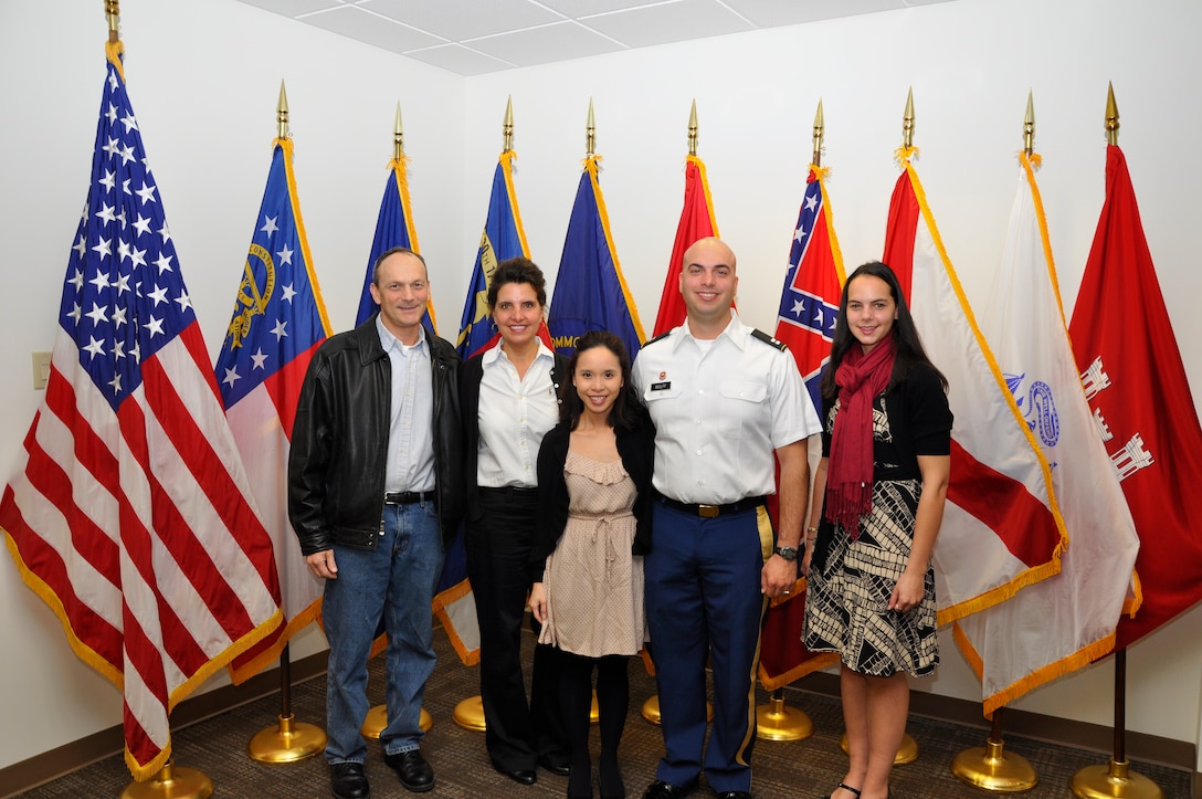 From left, parents Ted and Dona Wolff, fiancé Kim Phan, newly promoted Capt. Corey T. Wolff and his sister Hallie Wolff pause for a photograph after Corey’s promotion to captain Dec. 7, 2012 at the U.S. Army Corps of Engineers Nashville District. A native of Chatham, Ohio, a West Point graduate and combat veteran of Afghanistan, Capt. Wolff presently serves as project officer and quality assurance representative on the Cheatham Lock and Resource Management buildings contract in Ashland City, Tenn. (USACE photo by Fred Tucker)