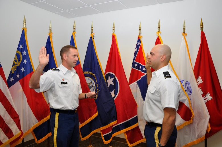 Lt. Col. James A. DeLapp, left, U.S. Army Corps of Engineers Nashville District commander, administers the Oath of Office to newly promoted Capt. Corey. T. Wolff Dec. 7, 2012. A native of Chatham, Ohio, Wolff is a 2009 West Point graduate, combat veteran of Afghanistan, and presently serves as project officer and quality assurance representative on the Cheatham Lock and Resource Management buildings contract in Ashland City, Tenn.