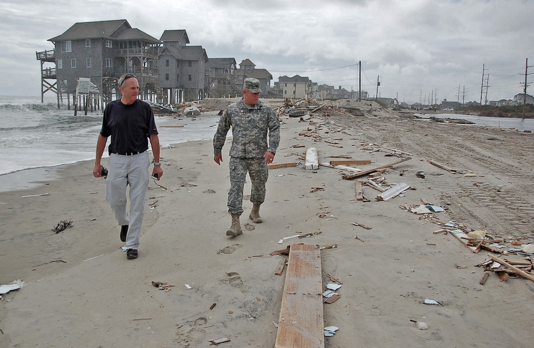 Wilmington District Commander Col. Steve Baker and Wanchese Survey Office Team Leader Steve Shriver survey damage at Rodanthe after Hurricane Irene hit coastal North Carolina n late Ausgust of 2011.  (USACE Photo by Hank Heusinkveld)